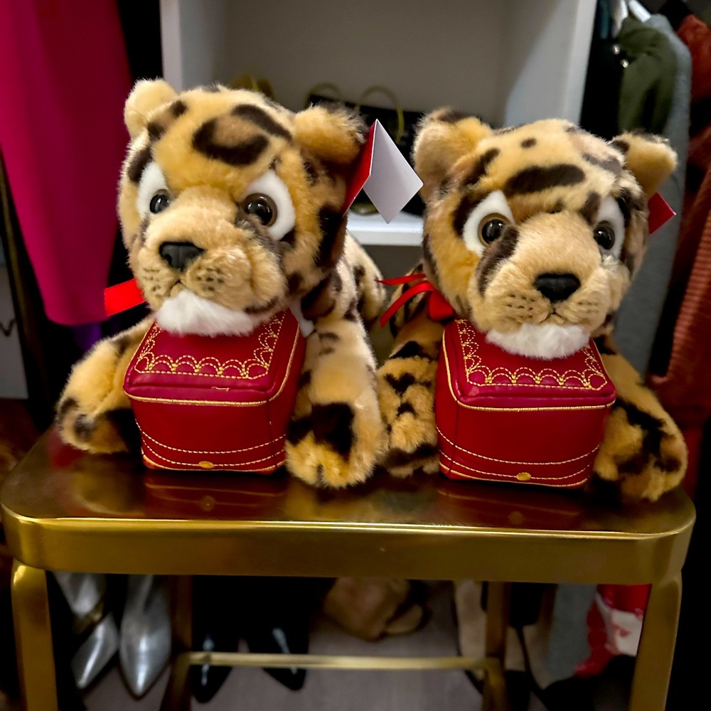 Cartier plush stuffed animal tigers. New with tags. Bags included . I have 2